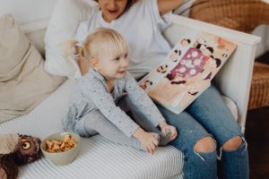 Grandmother and grandbaby reading a book together