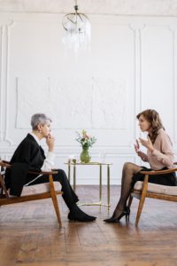 daughter explaining situation to mother