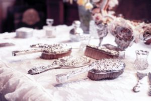 a vanity table with beautiful hair brushes