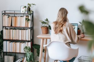 woman, busy at her desk on laptop