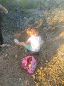 child hunting rocks